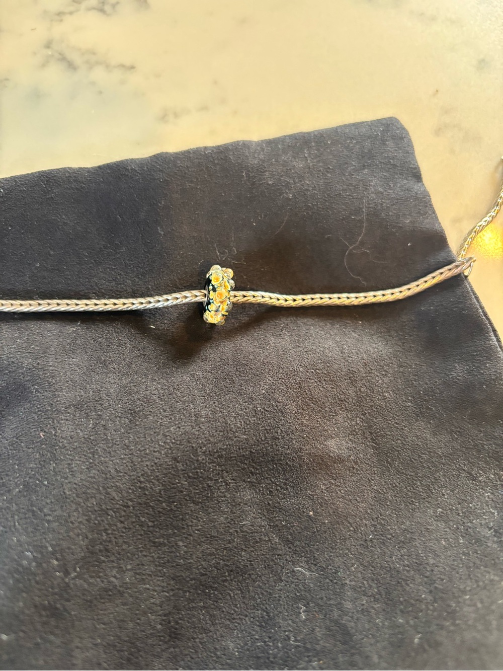 Auth Trollbead , featuring the retired Murano glass bead known as "Milan"